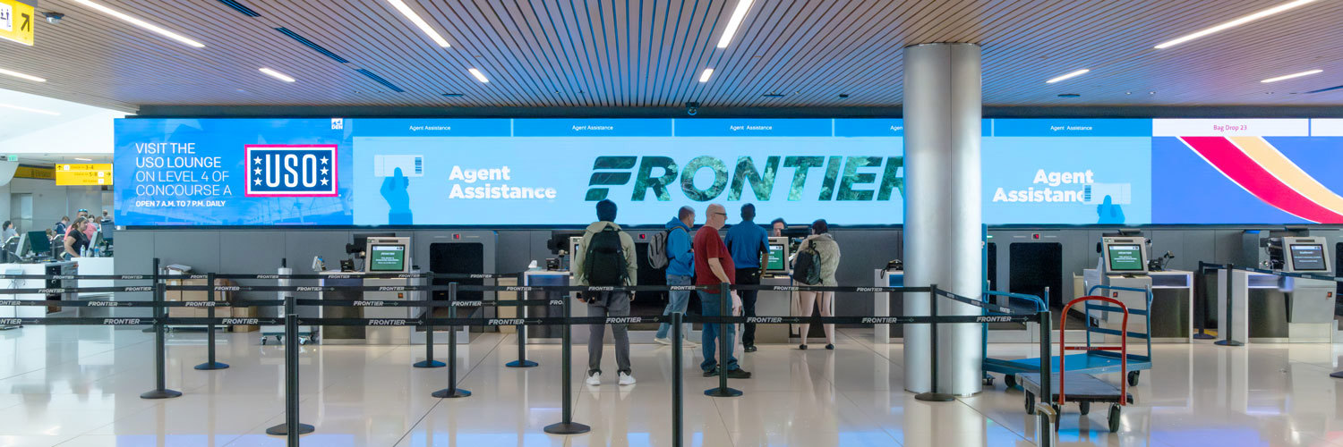 digital sign for airline name at ticket counter