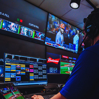 Person using Daktronics software to control video displays