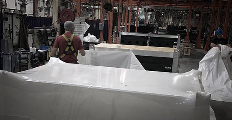 workers preparing display for shipping