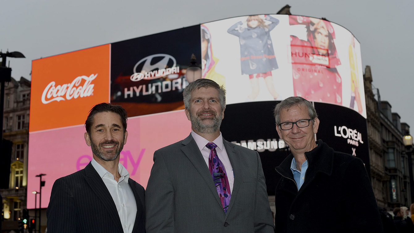 Business Leaders in Front of Display