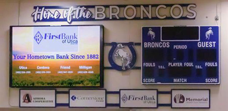 Indoor video board alongside fixed digit scoreboard