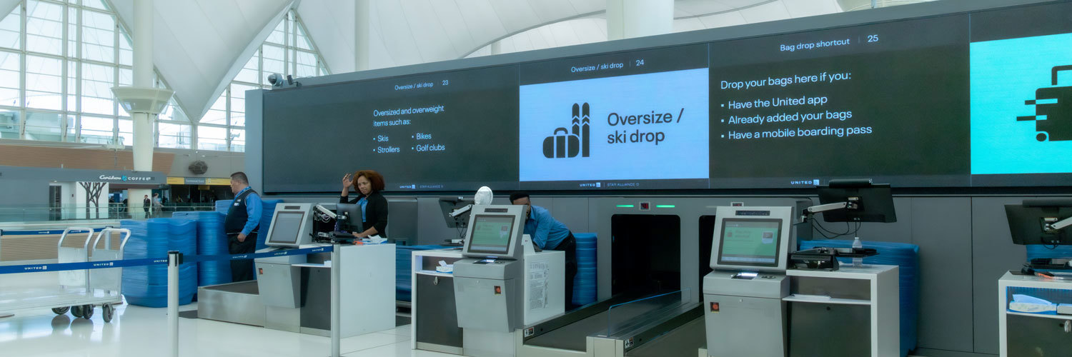 LED displays behind counter at DEN airport
