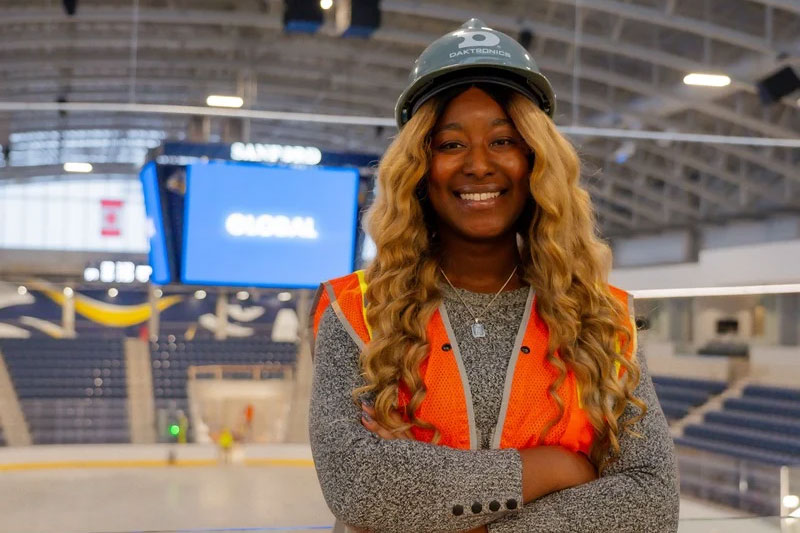 woman working on site at Sanford event center