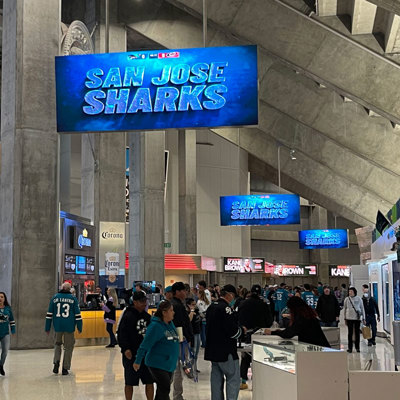 wayfinding and branding signage in San Jose Sharks concourse