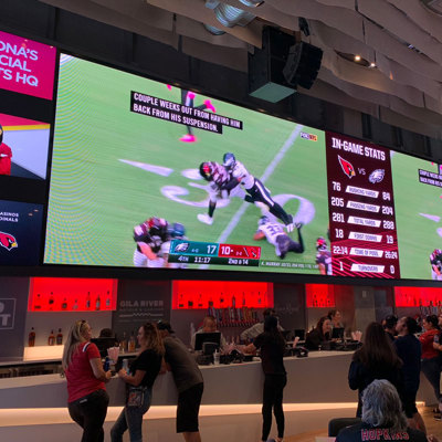 large screen video wall behind concourse bar