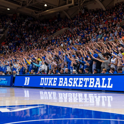cheering crowd behind Duke's LED scorers table