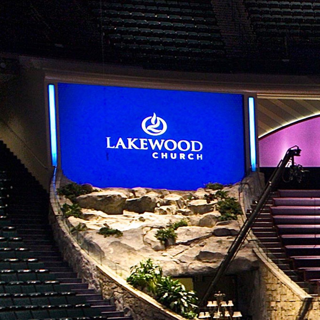 Digital display behind church seating