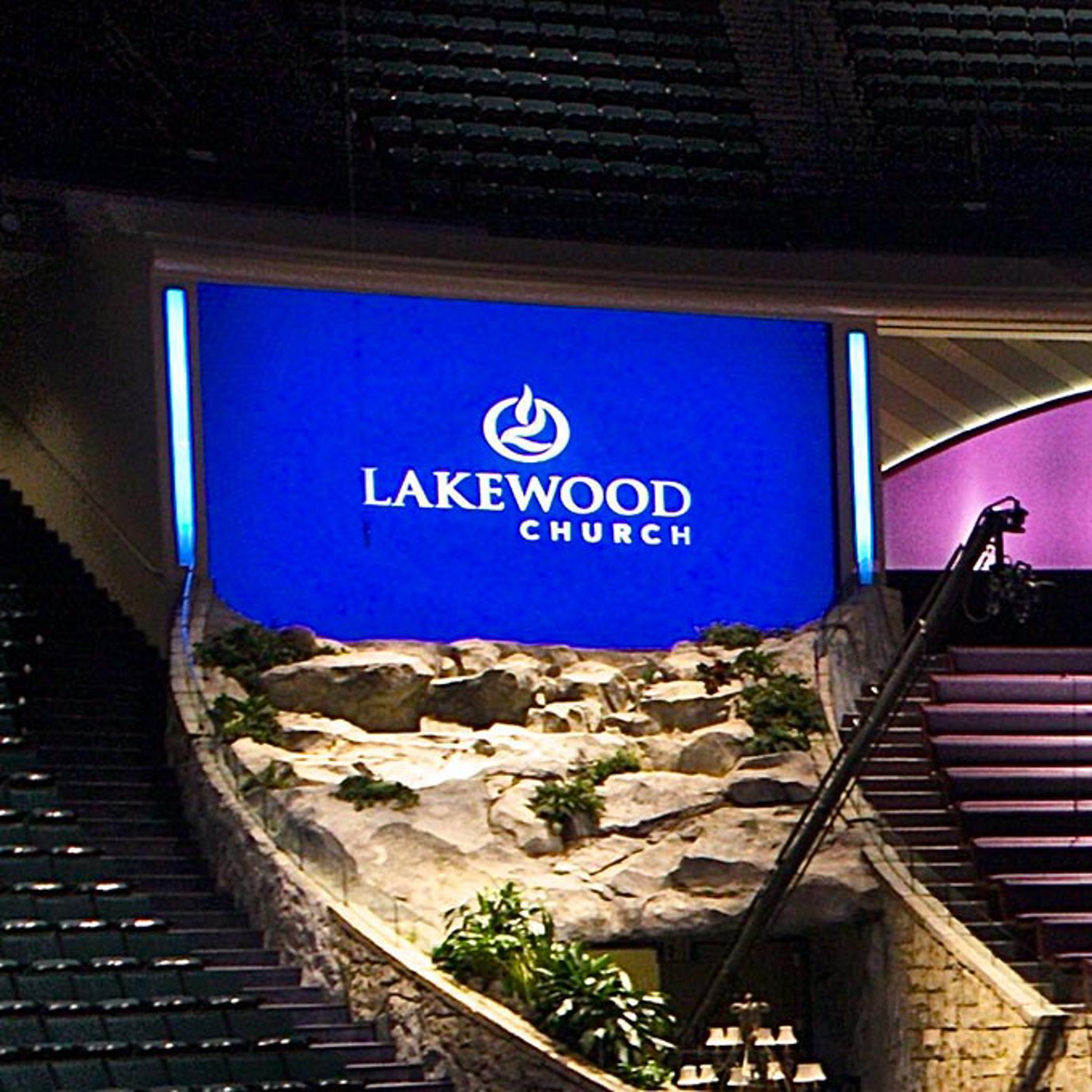 Digital display behind church seating