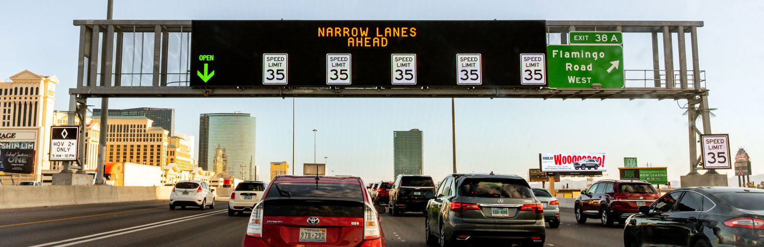 atm sign warning narrow lanes ahead